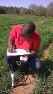 Ricardo St. Aime collecting cover crop data Ricardo St. Aime collecting cover crop data
