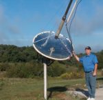 Dan West next to a solar collector