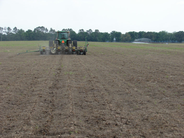 Figure 8.2a A tractor in a field of brown soil