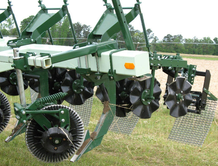 Figure 9.8 A green tractor with different wheel tools