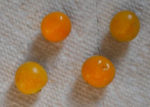 Four goldenberries laying on a paper towel