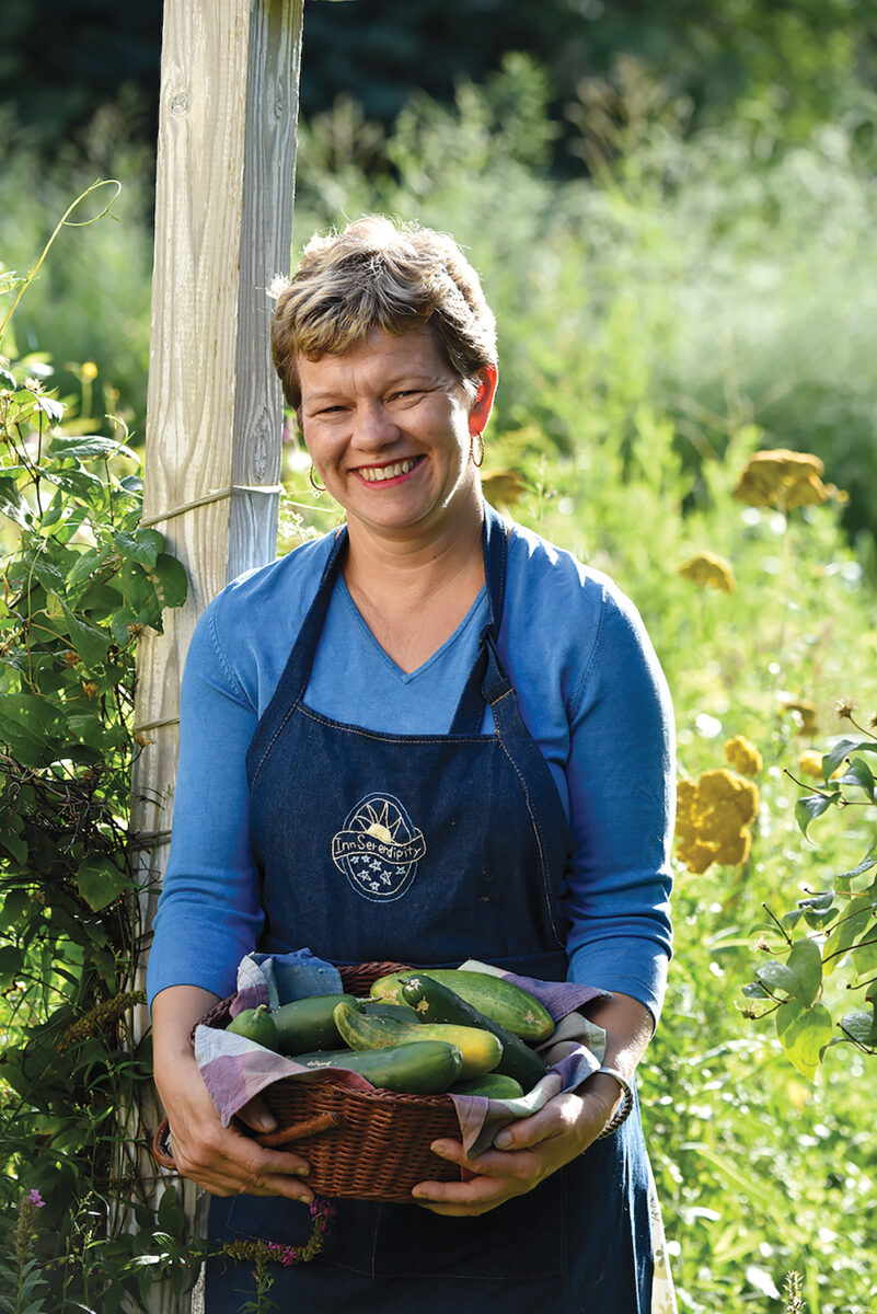 Woman with a basket of cucumbers
