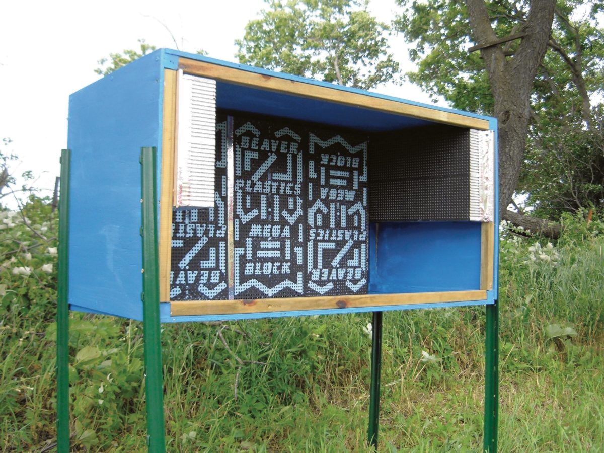 Homemade shelter holding a series of nest blocks.