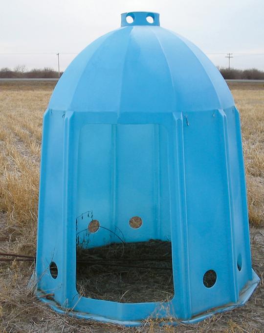 Tent-like manufactured bee shelter.