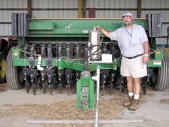 Mark Davis, an agronomist at USDA-ARS ’s Sustainable Agricultural Systems Lab in Beltsville, Md., examines a no-till drill as part of a long-term experiment that compares crop production, weed pressure and soil dynamics in organic and conventional cropping systems.