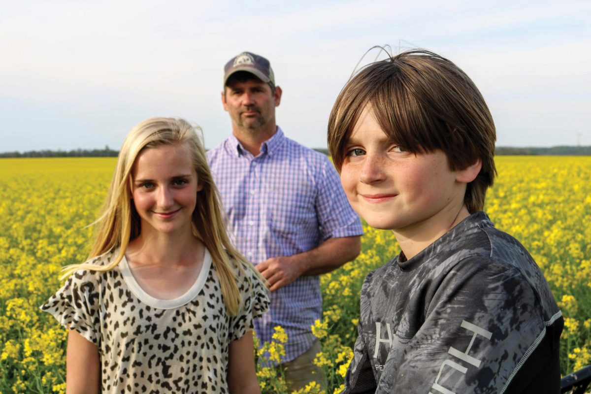 Farmer posing with his children Farmer posing with his children
