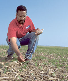 NRCS agent Wendell Jones measuring residue