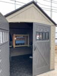 An outdoor plastic shed repurposed as a darkroom for testing the effectiveness of UV light exposure.