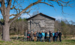 Students in front of barn