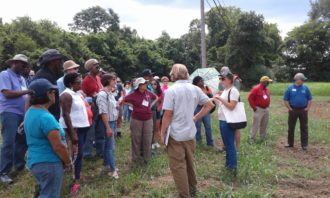 Stony Creek People standing around listening to a presentation in Stony Creek