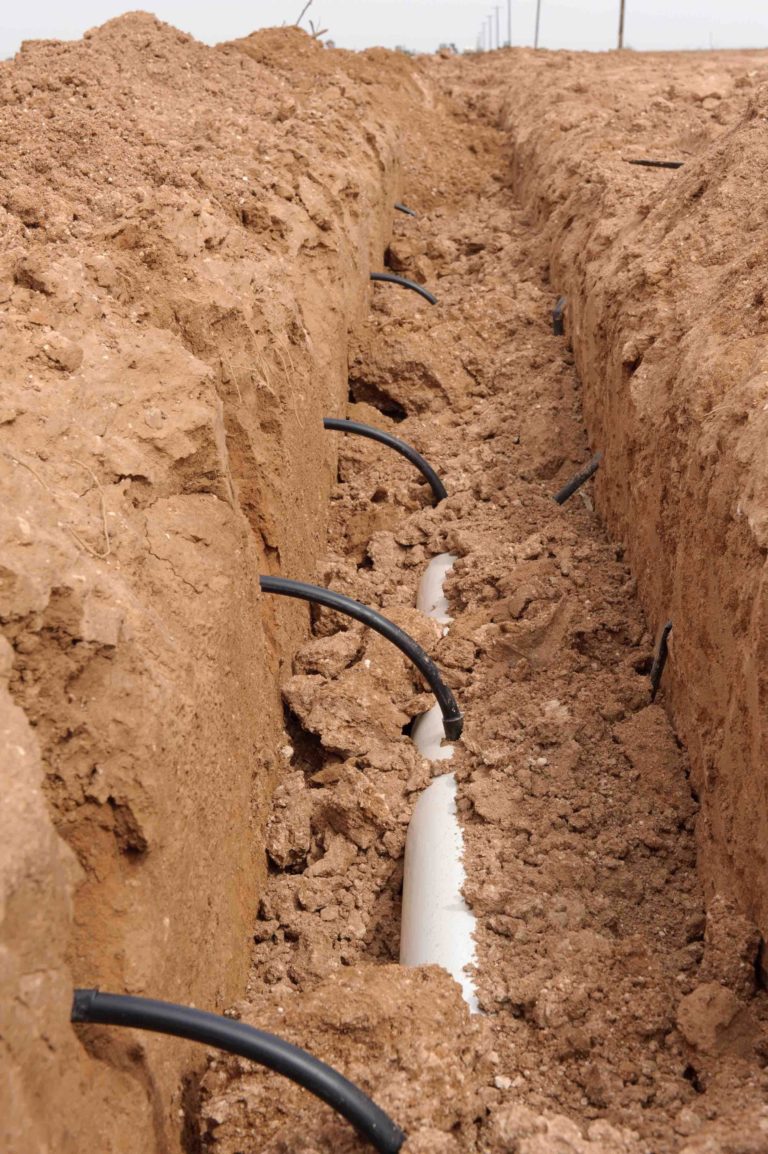 Trench with subsurface irrigation pipes
