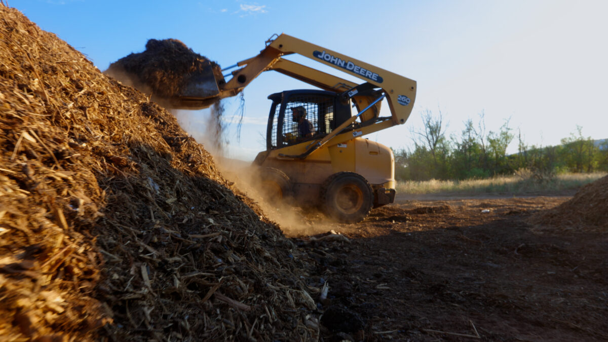 A tractor shoveling dirt