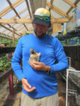 farmer holding rabbit