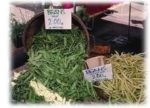 Baskets of beans for sale, flowing out of the basket