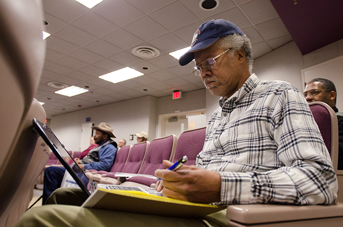 farmer taking notes at a workshop