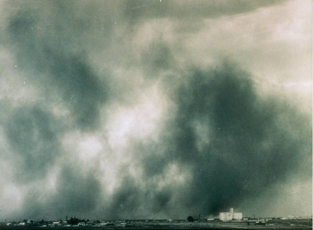 Dust bowl photograph with large blooms of dark soot in the air