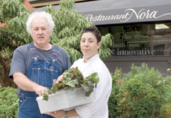 Upscale restaurants like Restaurant Nora in Washington, D.C., feature ingredients procured from local farmers as a hook to draw customers.