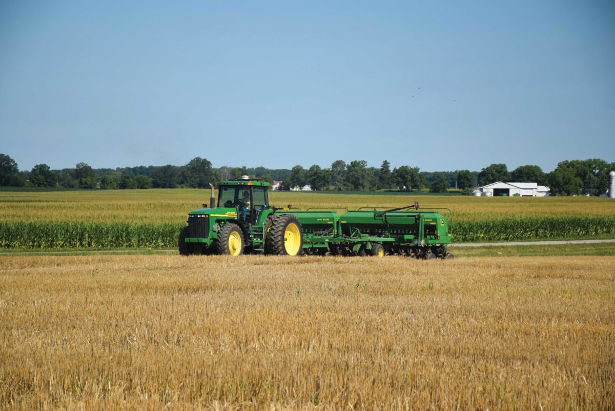 A tractor passing through a field A tractor passing through a field