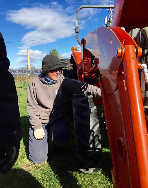 woman talking about a tractor
