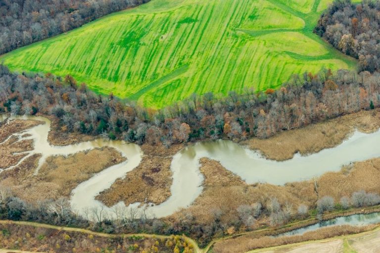 aerial view of farm fields and creek aerial view of farm fields and creek